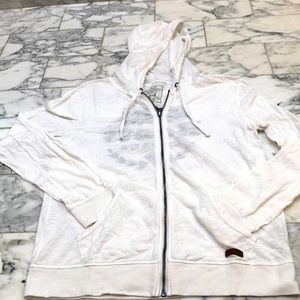 Vintage white Roots Canada zip-up hoodie.